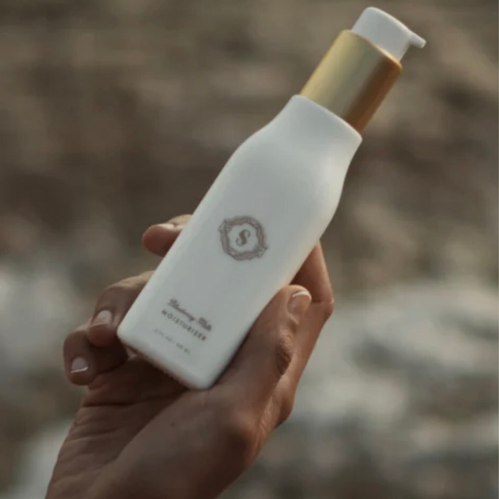 Sorella Apothecary Blueberry Milk Moisturizer hand-held lifestyle image