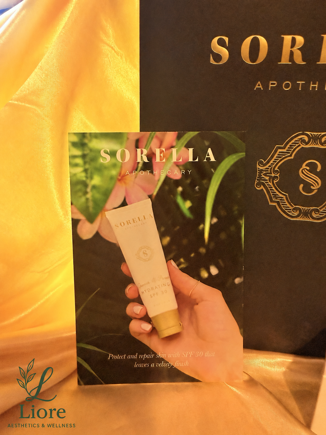 Sorella Apothecary Quench & Protect Hydrating SPF 30 with Liore Aesthetics & Wellness logo
